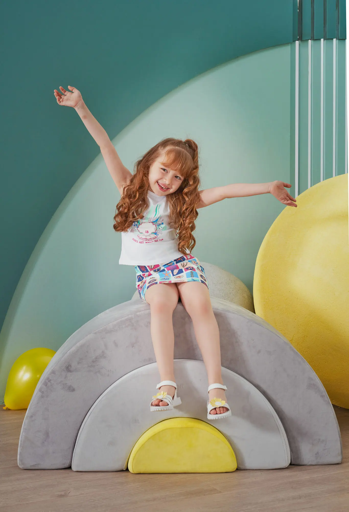 Child playing on the Minimoon play arch